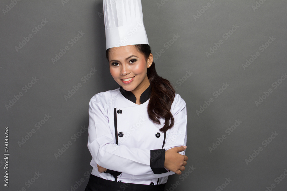 female chef in a traditional hat and coat