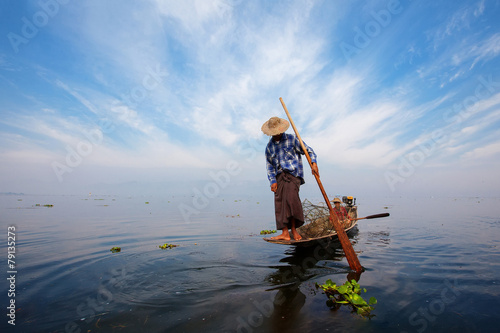 Leinwand Poster Fishermen in Inle lakes sunset, Myanmar.