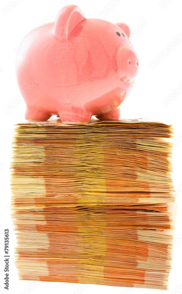 tirelire cochon sur liasses de billets empilés Photos | Adobe Stock