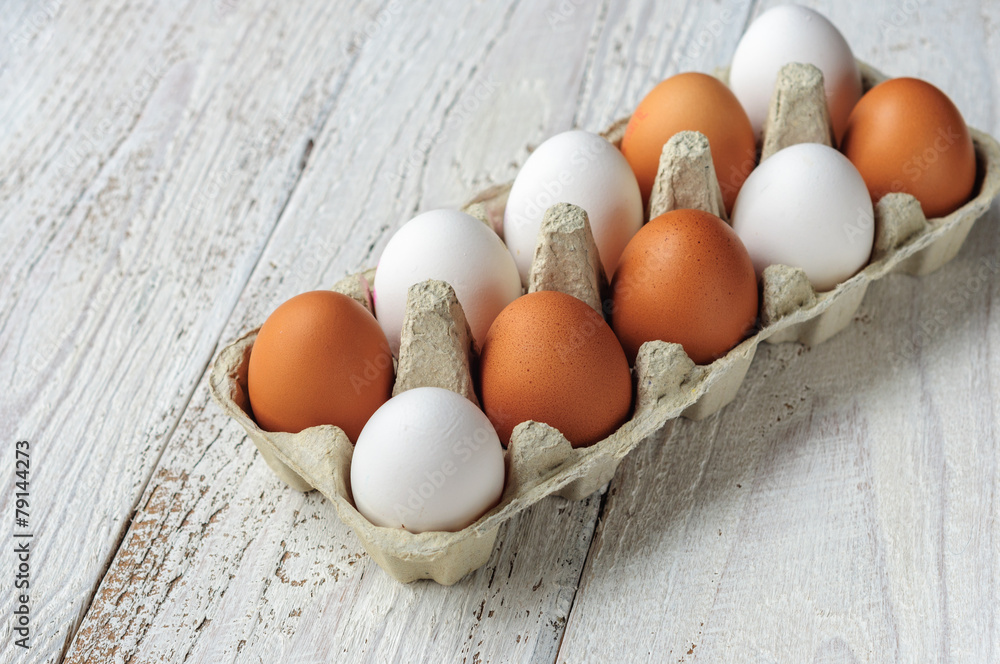 White and brown eggs in carton White and brown eggs in carton