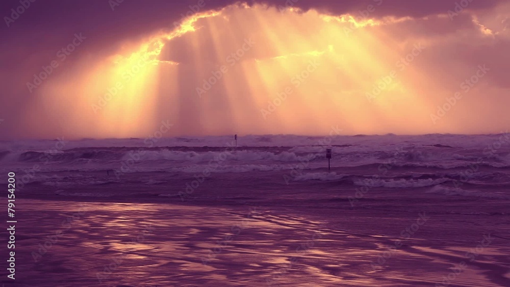 The Stormy Weather - Sunset beam over sea The Stormy Weather - Sunset beam over sea