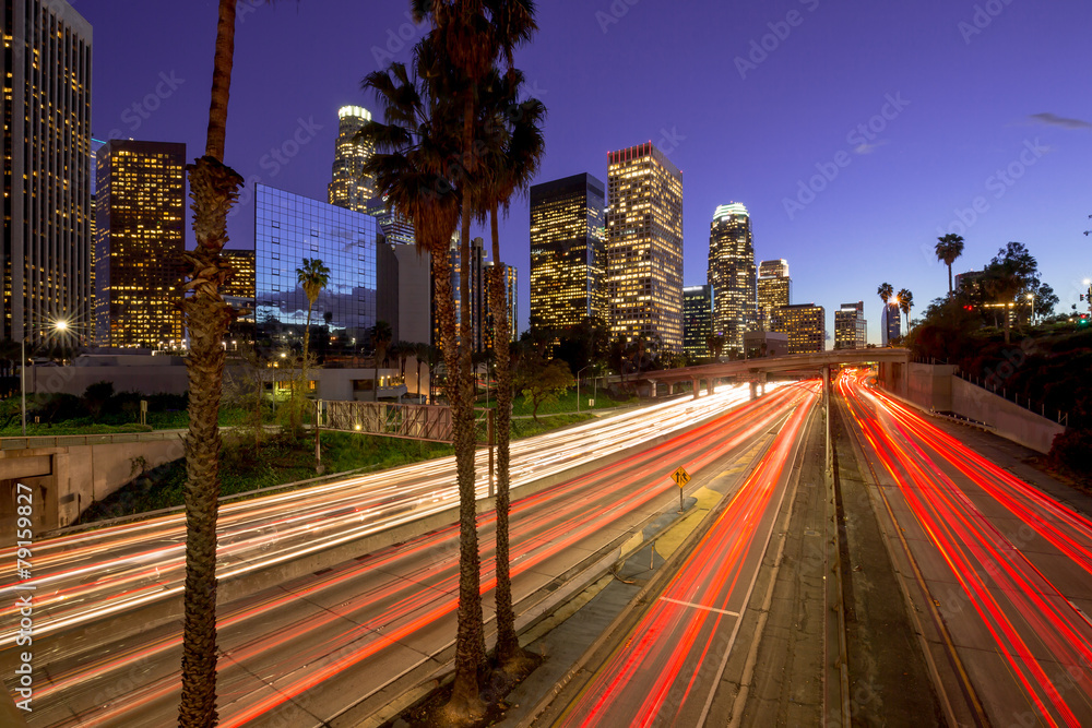 Fototapeta premium Los Angeles downtown buildings and highway traffic at night