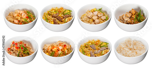 set of bowls with rice meat seafood and sesame isolated on white