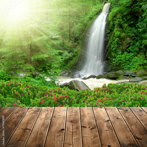 Beautiful waterfall with wooden planks