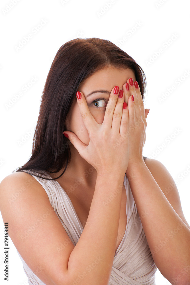 Afraid frightened woman peeking through her fingers. Afraid frightened woman peeking through her fingers.