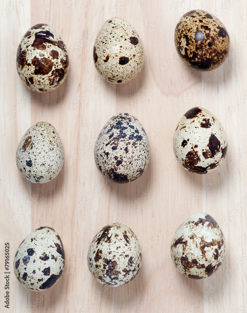 Fototapeta premium some quail eggs on the wooden table