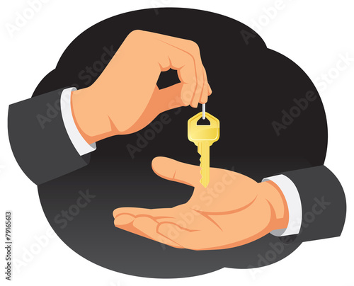 Businessman hand provides the key to the real estate buyer
