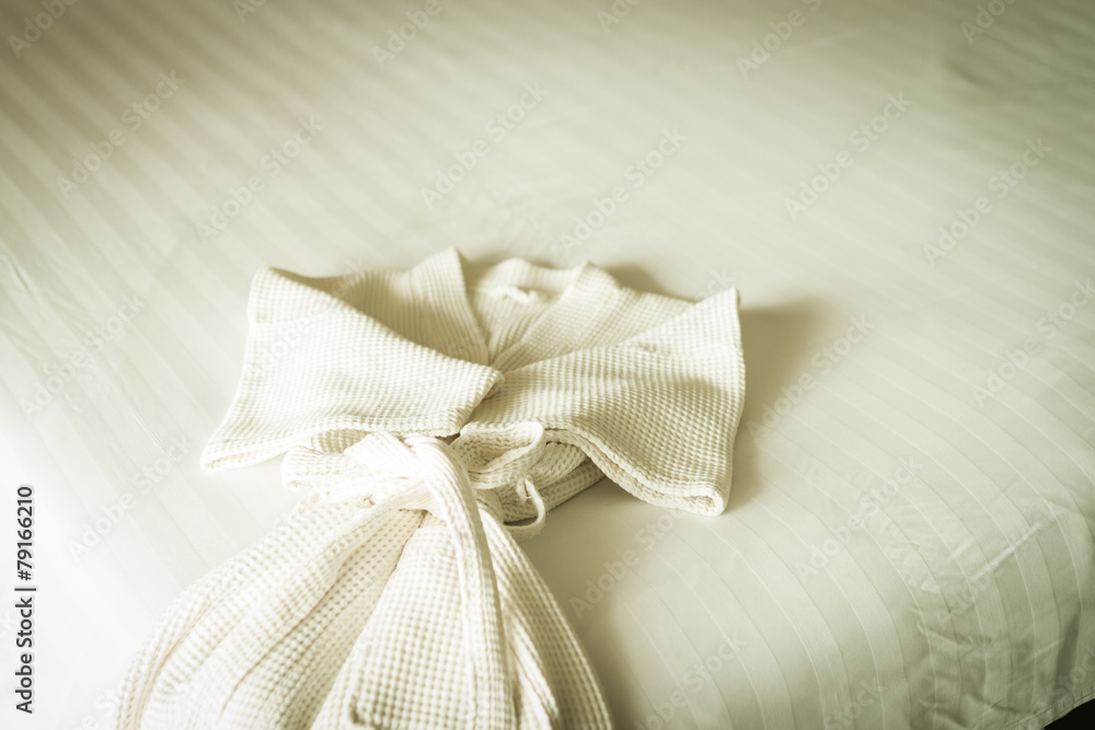 white bathrobe on bed white bathrobe on bed
