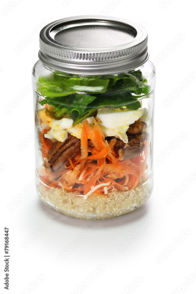 vegetable salad in glass jar isolated on white background vegetable salad in glass jar isolated on white background