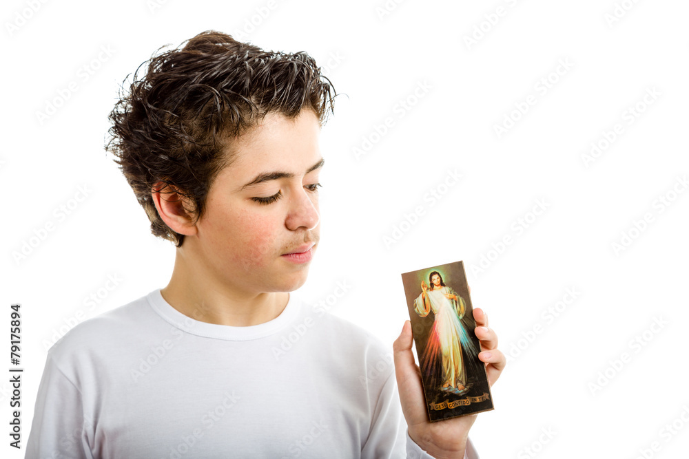 Hispanic boy holding Merciful Jesus icon Hispanic boy holding Merciful Jesus icon