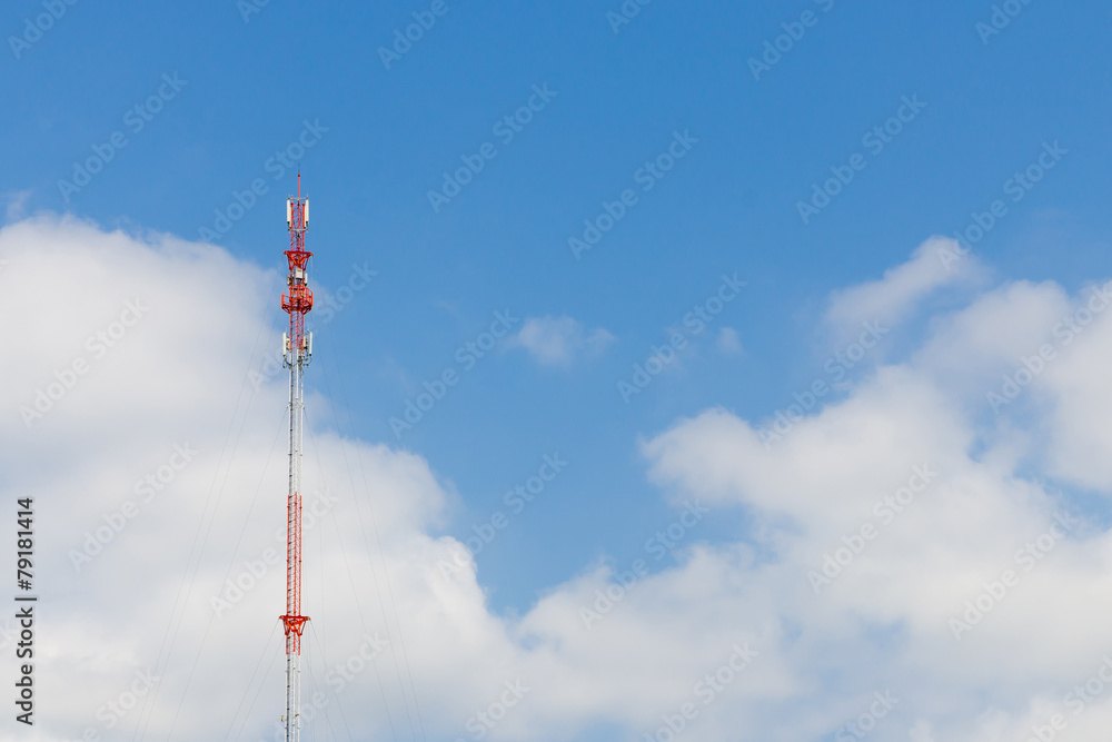Outdoor tele communication red and white tower blue sky and clou Outdoor tele communication red and white tower blue sky and clou