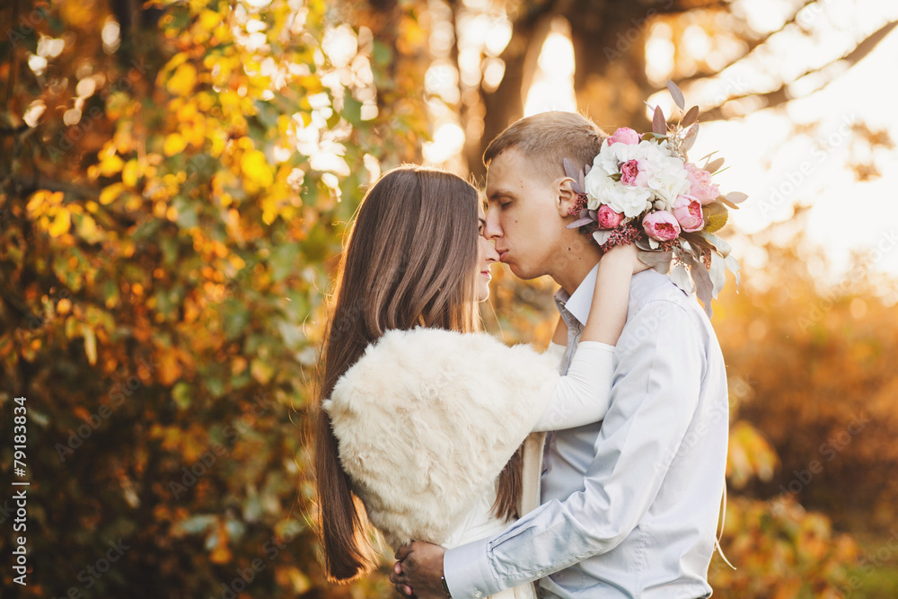 Fototapeta premium Young couple in love. Man kisses a woman's nose