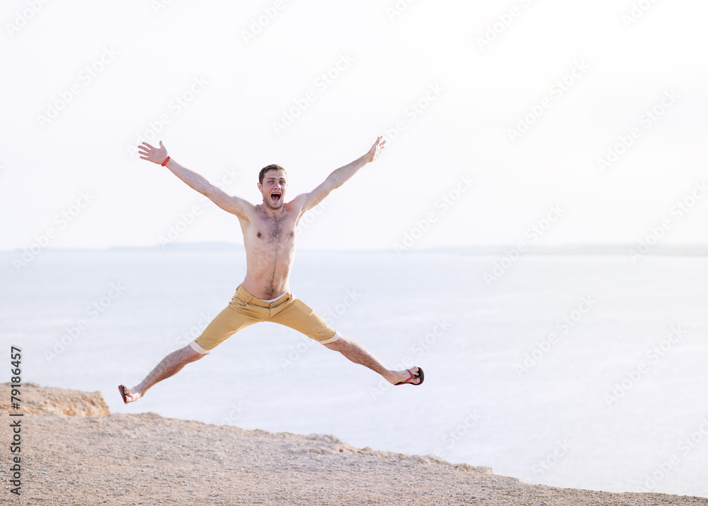 cheerful handsome guy in shorts jumping cheerful handsome guy in shorts jumping