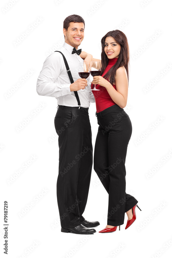 Young couple drinking red wine and posing Young couple drinking red wine and posing