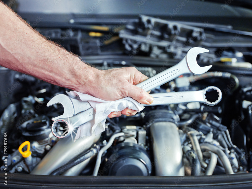 Combination wrench in front of motor Combination wrench in front of motor