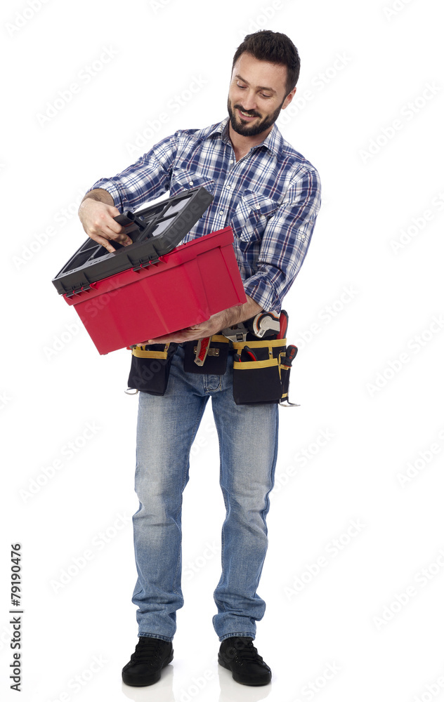 Handyman looking at toolbox Handyman looking at toolbox
