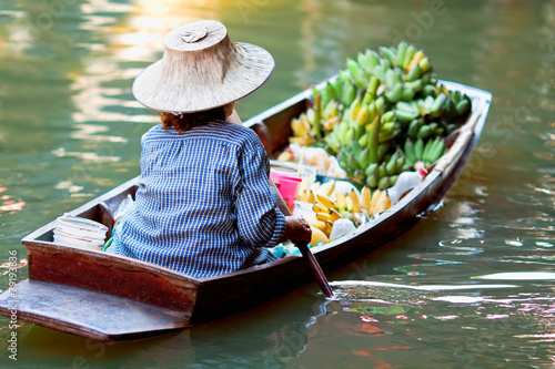 Photography saleswoman at Floating Market Damnoen Saduak, Thailand