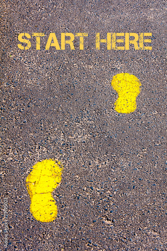 Yellow footsteps on sidewalk towards Start Here message