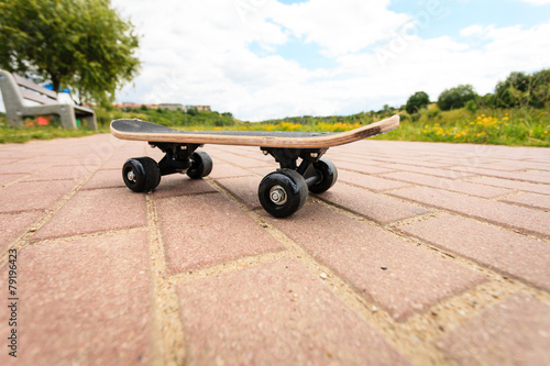 lone skateboard deck outdoor on paving stone