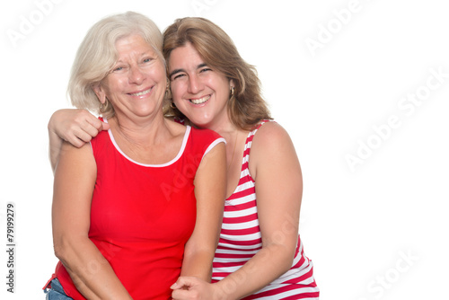 Adult hispanic woman hugging her older mother