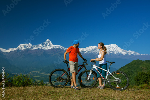 Fototapeta Naklejka Na Ścianę i Meble -  Biker family in Himalaya mountains, Anapurna region