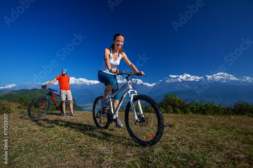 Fototapeta Naklejka Na Ścianę i Meble -  Biker family in Himalaya mountains, Anapurna region