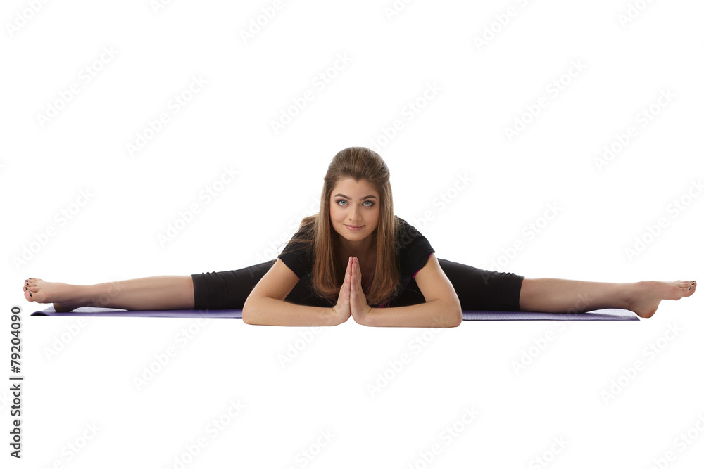 Relaxed woman posing in difficult stretching pose Relaxed woman posing in difficult stretching pose