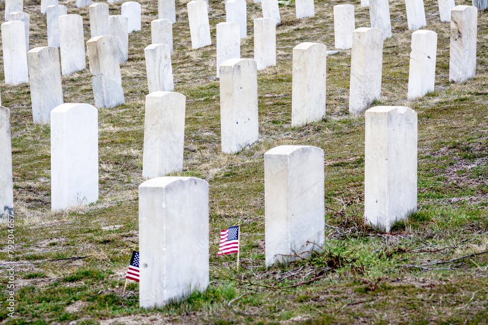 White tomb stones at a military cemetery