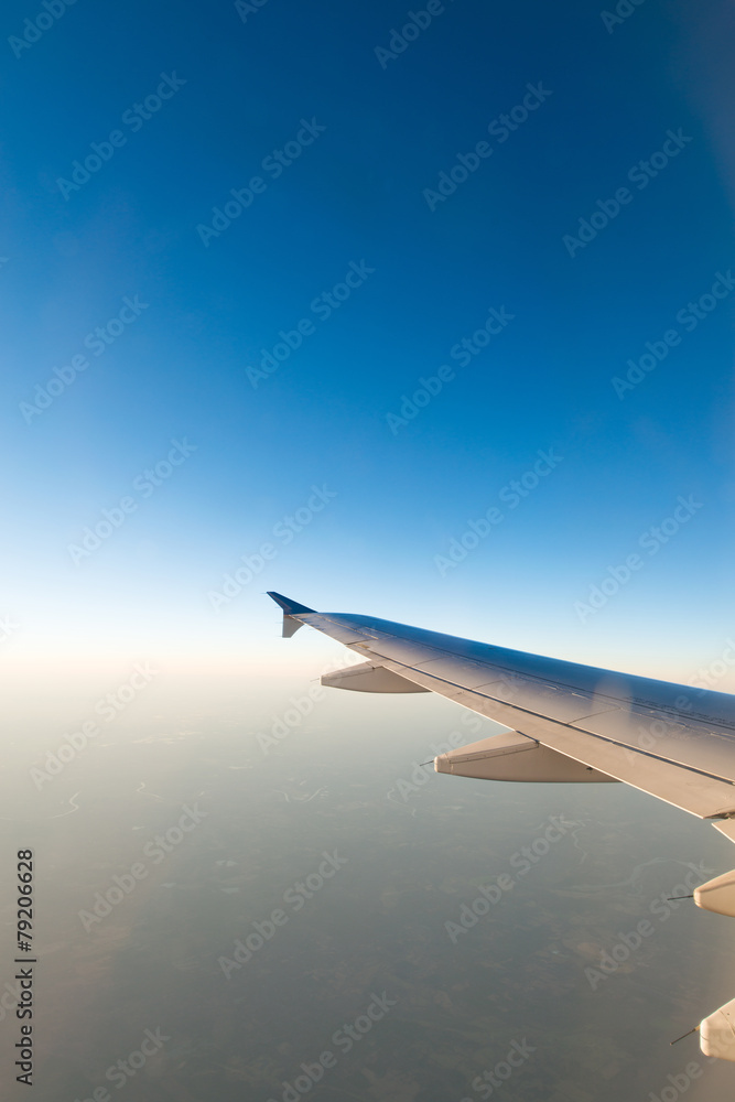 Airplane wing out of window Airplane wing out of window