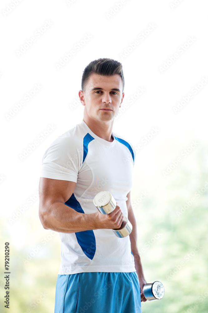 Fototapeta premium man exercise with weights
