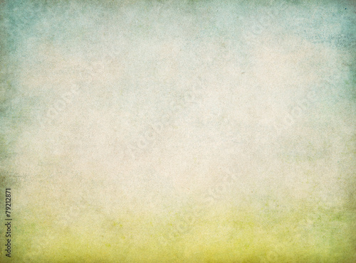 abstract vintage paper background with green grass and blue sky