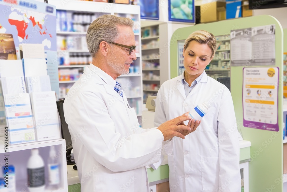 Team of pharmacists speaking about medication Team of pharmacists speaking about medication