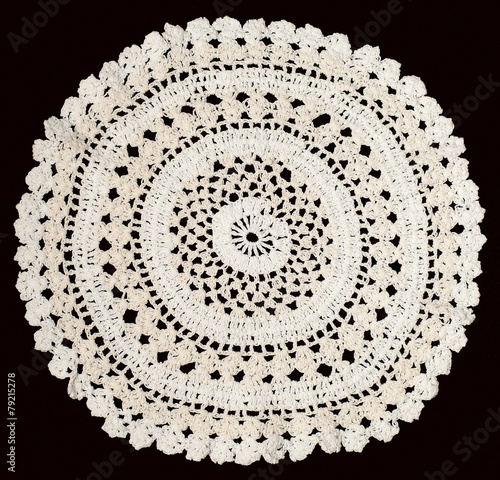 Vintage white knitted napkin isolated on a black background