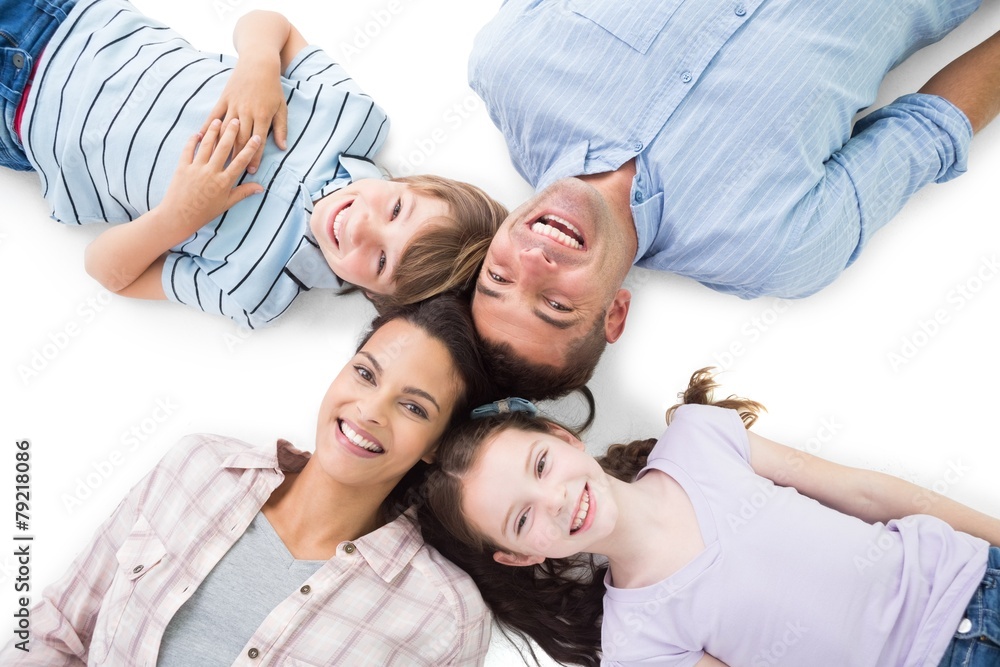 Happy parents and children lying on white background