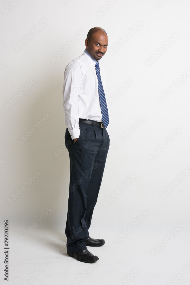 indian business male with plain background and shadows