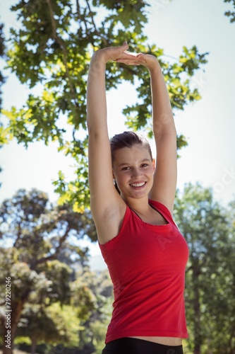 Fit woman stretching her arms