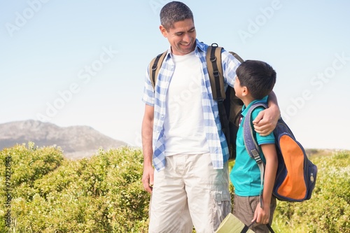 Father and son hiking in the mountains