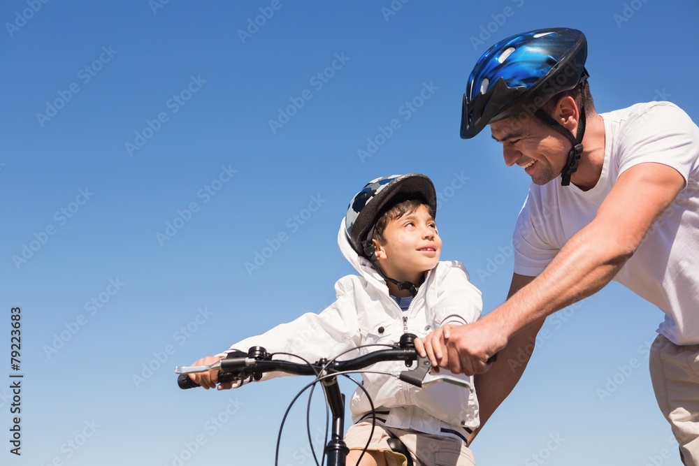 Father and son on a bike ride Father and son on a bike ride