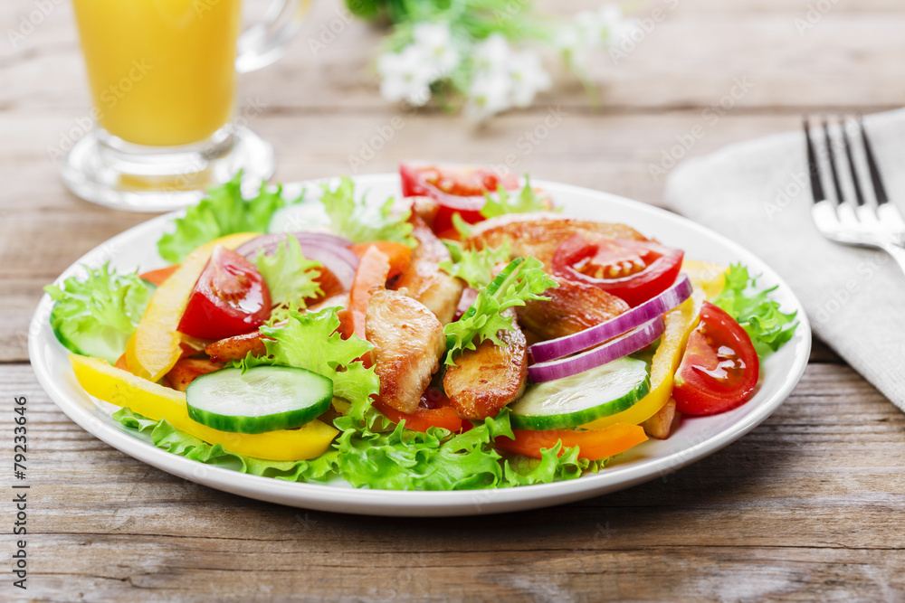 Salad with grilled chicken fillet tomatoes peppers and cucumber Salad with grilled chicken fillet tomatoes peppers and cucumber