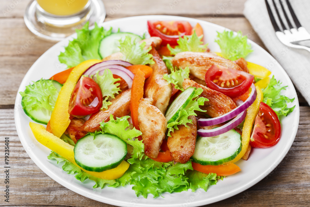 Salad with grilled chicken fillet tomatoes peppers and cucumber Salad with grilled chicken fillet tomatoes peppers and cucumber