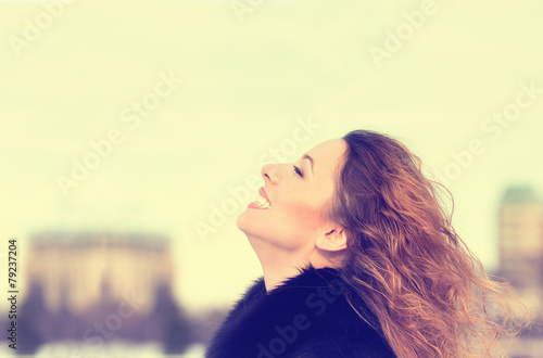 Woman smiling looking up to blue sky taking deep breath © pathdoc