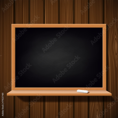 Blackboard with a chalk on a wooden wall