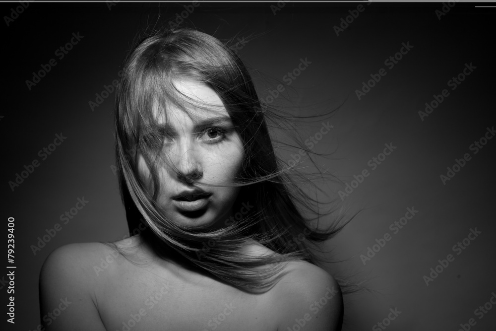 Portrait of a beautiful girl on a black background. Portrait of a beautiful girl on a black background.