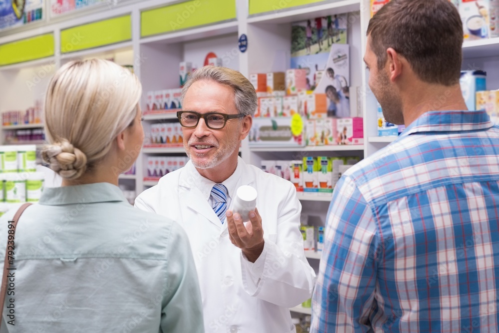 Senior pharmacist explaining the pills to patient