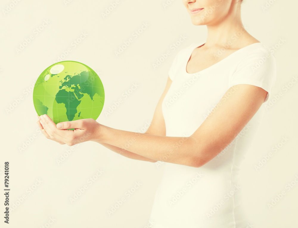 woman holding green sphere globe woman holding green sphere globe
