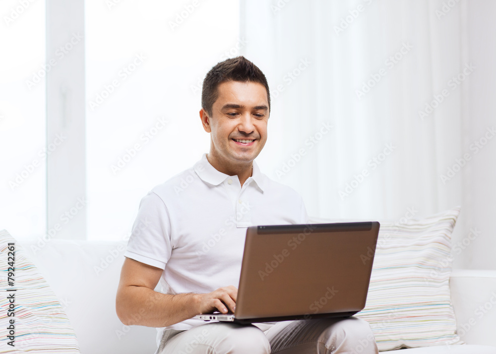 happy man working with laptop computer at home happy man working with laptop computer at home