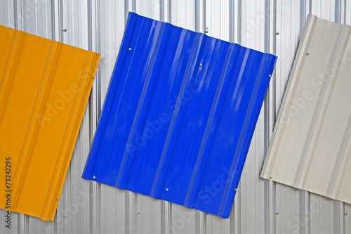 Metal roof painted by silver, blue, yellow color