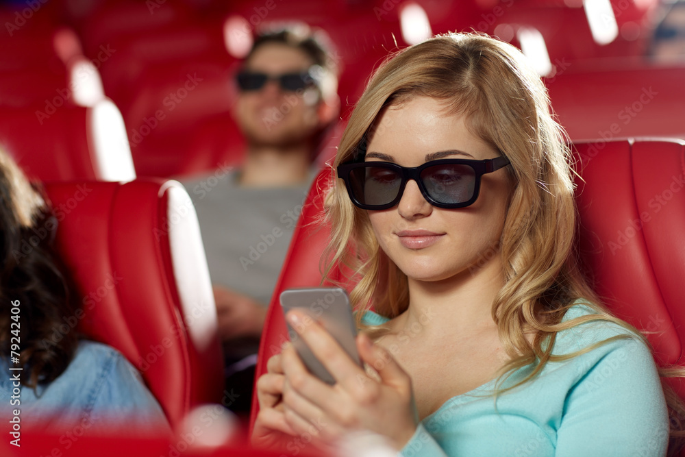 happy woman with smartphone in 3d movie theater happy woman with smartphone in 3d movie theater