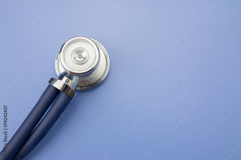 Stethoscope on a blue background - obrazy, fototapety, plakaty 