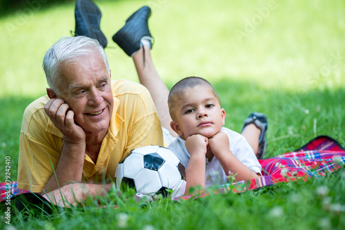 grandfather and child have fun  in park